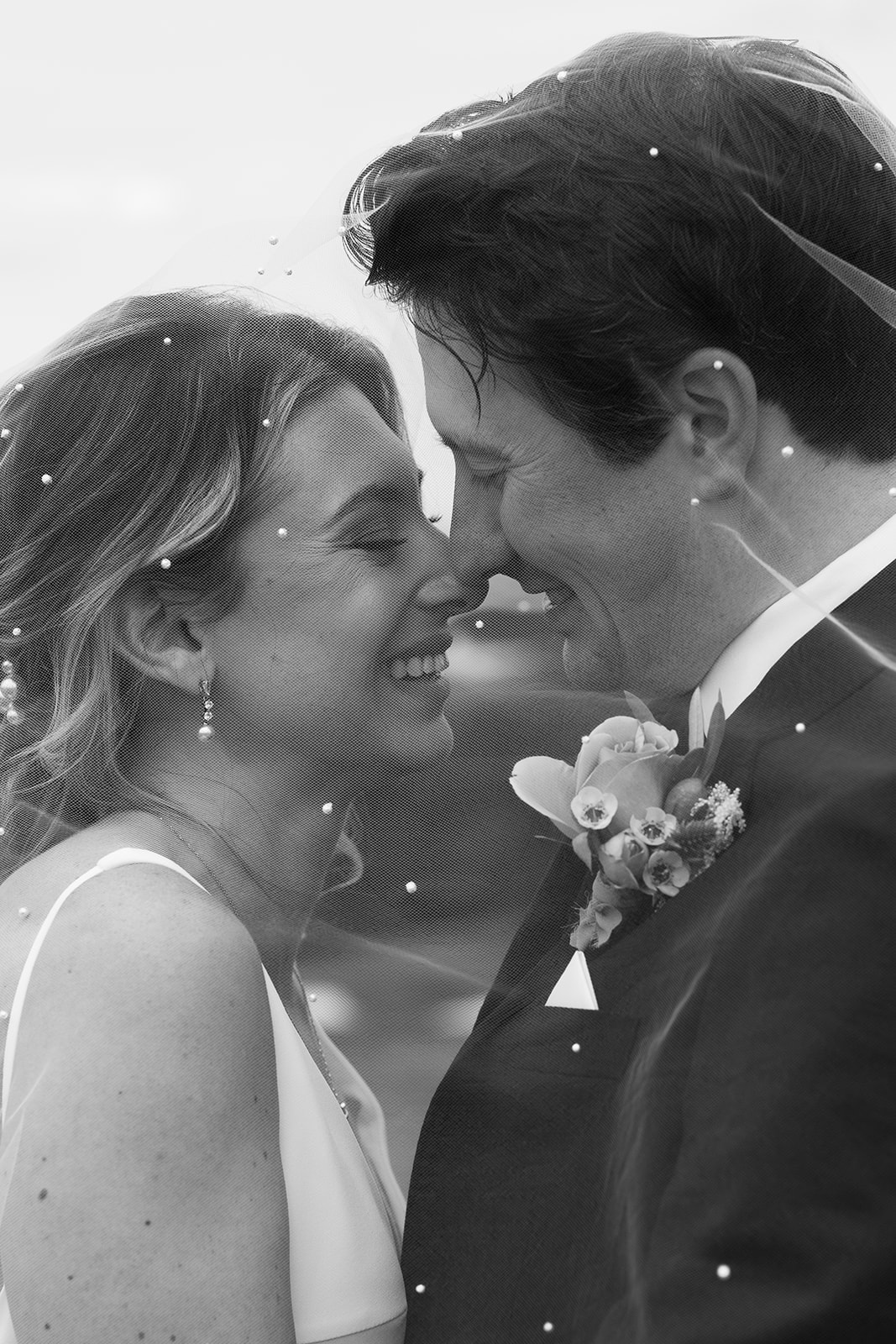 balck and white photo of Bride and groom kissing