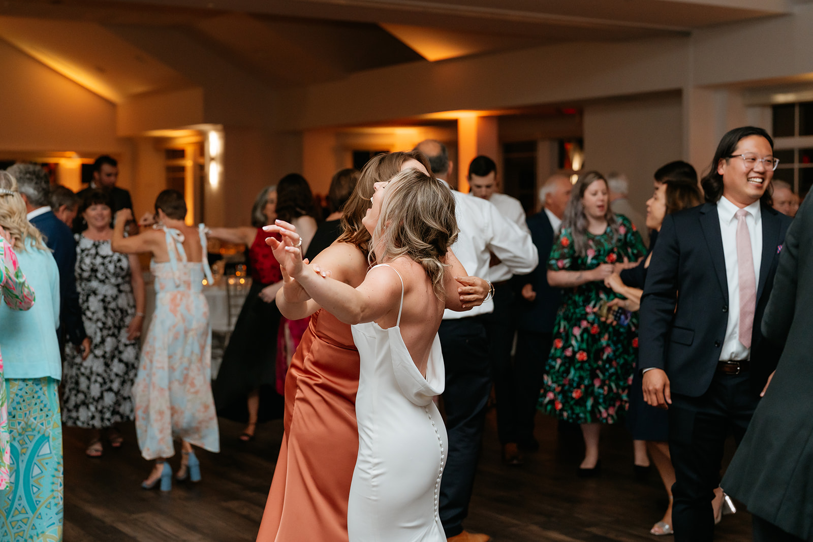 A joyful bride and groom dancing together at their wedding reception in Granite Links celebrating their special day with love and happiness.