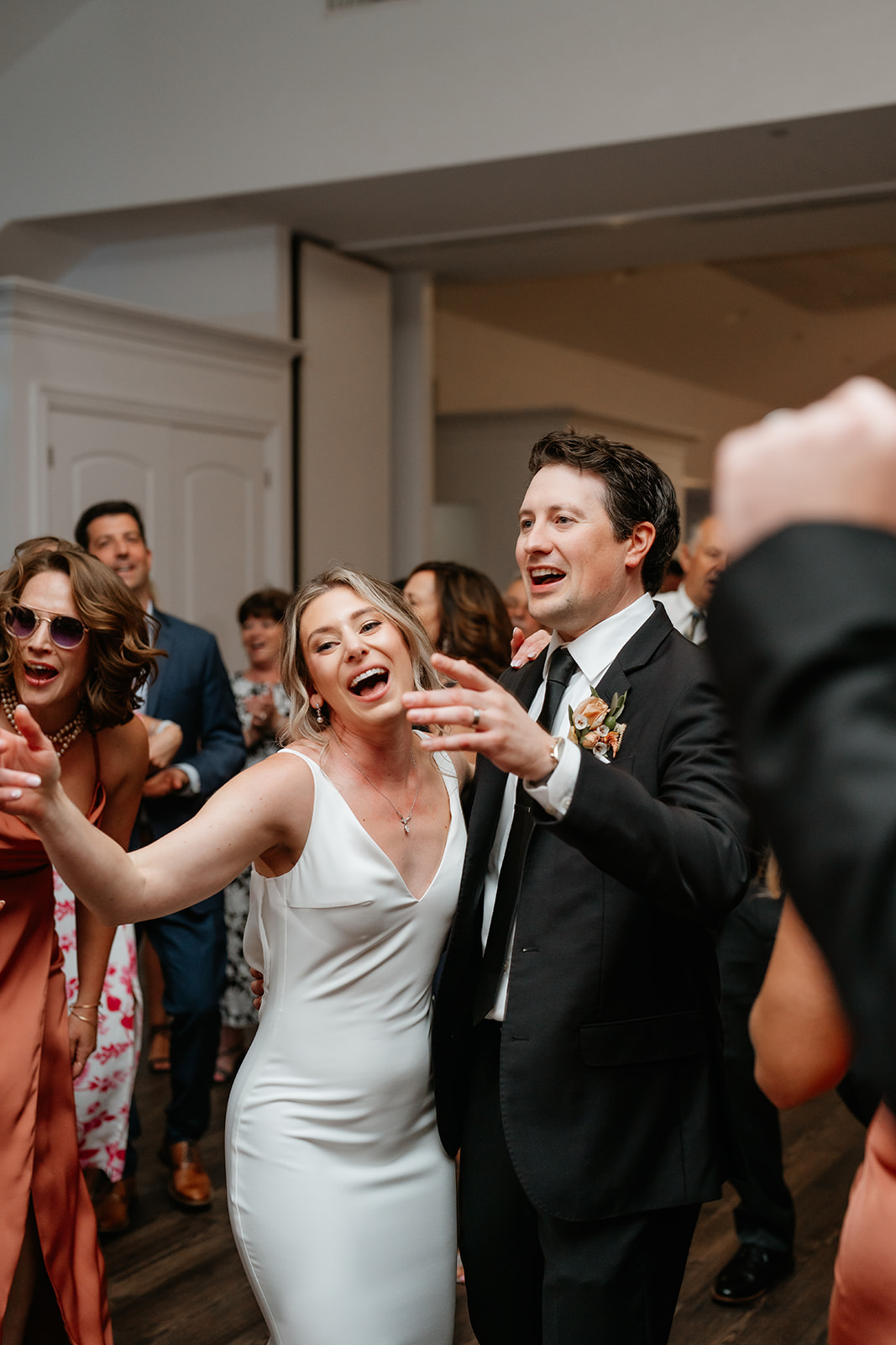 A joyful bride and groom dancing together at their wedding reception in Granite Links celebrating their special day with love and happiness.