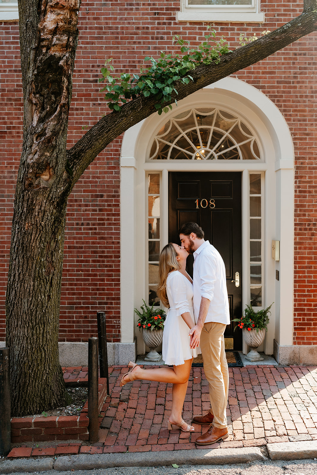 Couple kissing on the cobblestone streets of Beacon Hill for their Beacon Hill couples session