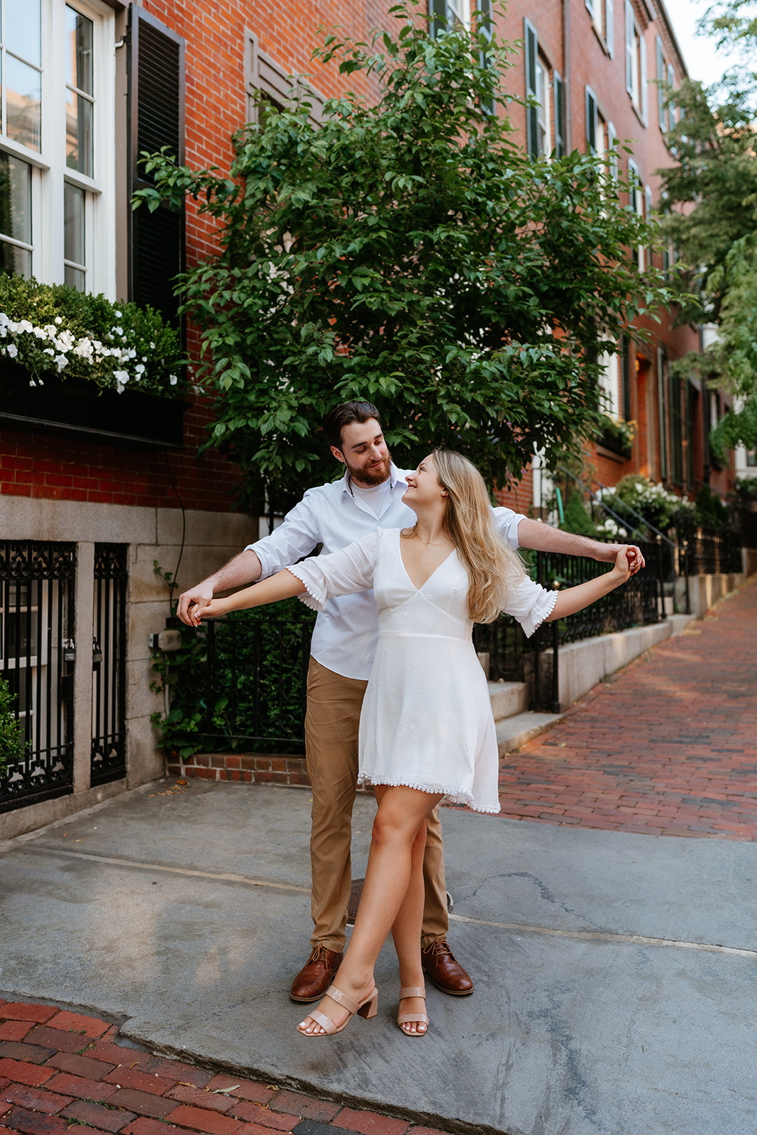 Couple dancing on the streets of Beacon Hill