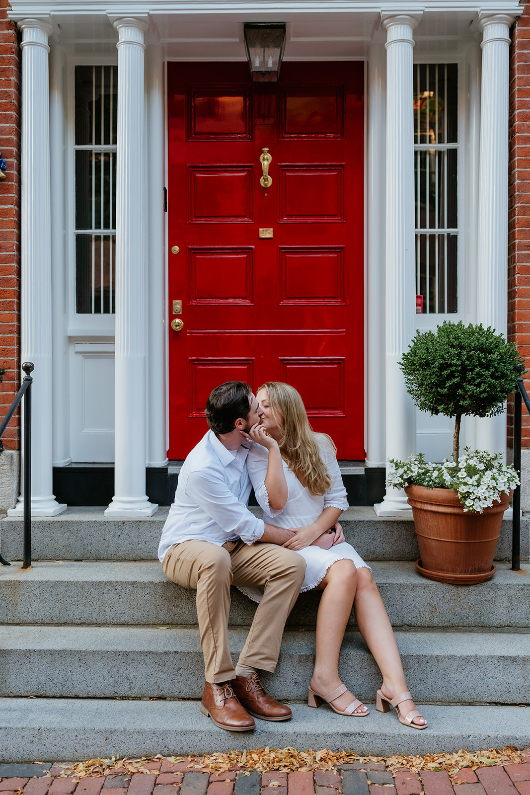 Couple kissing on the streets of Beacon hill for their beacon hill couple session