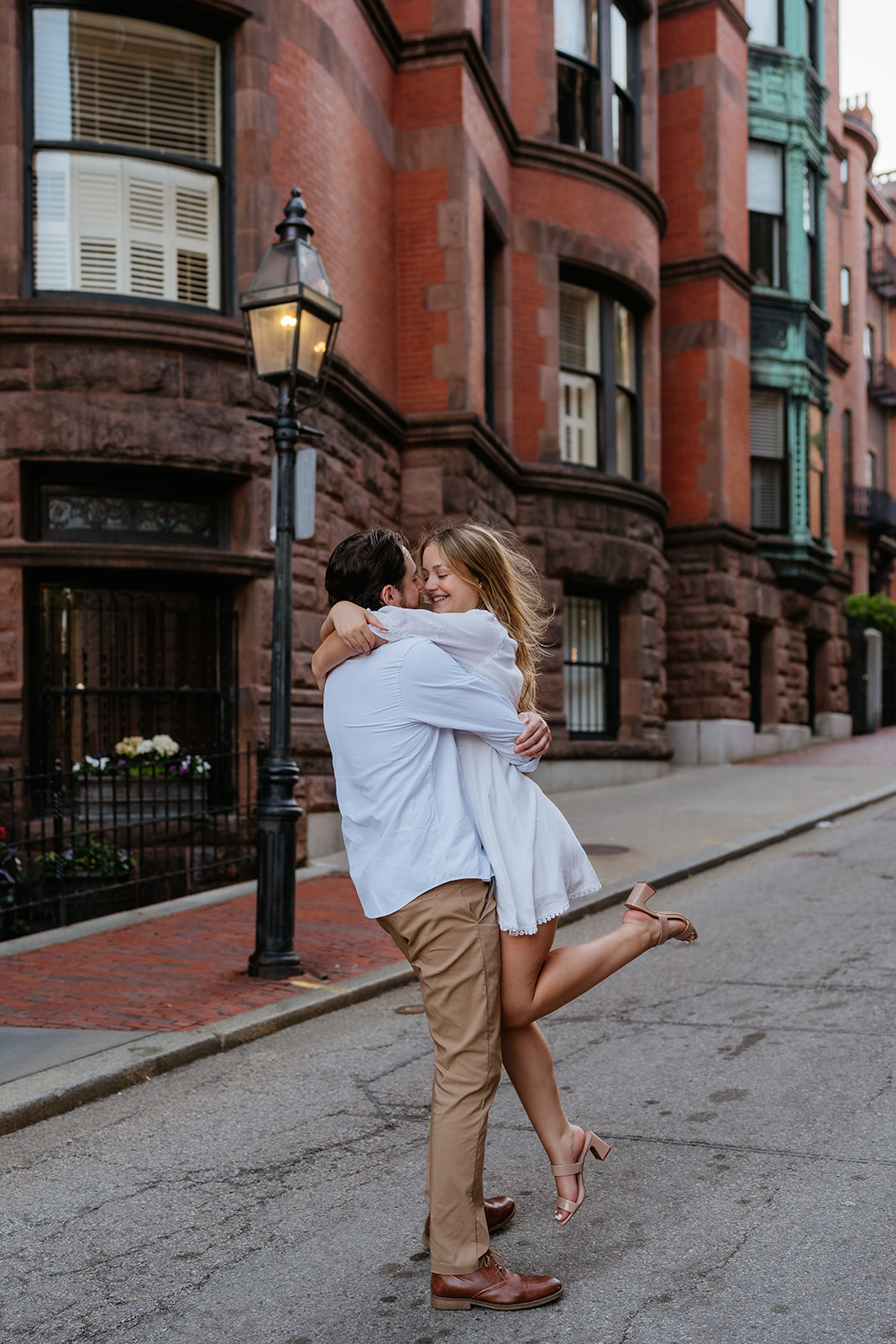 Couple dancing on the streets of Beacon Hill