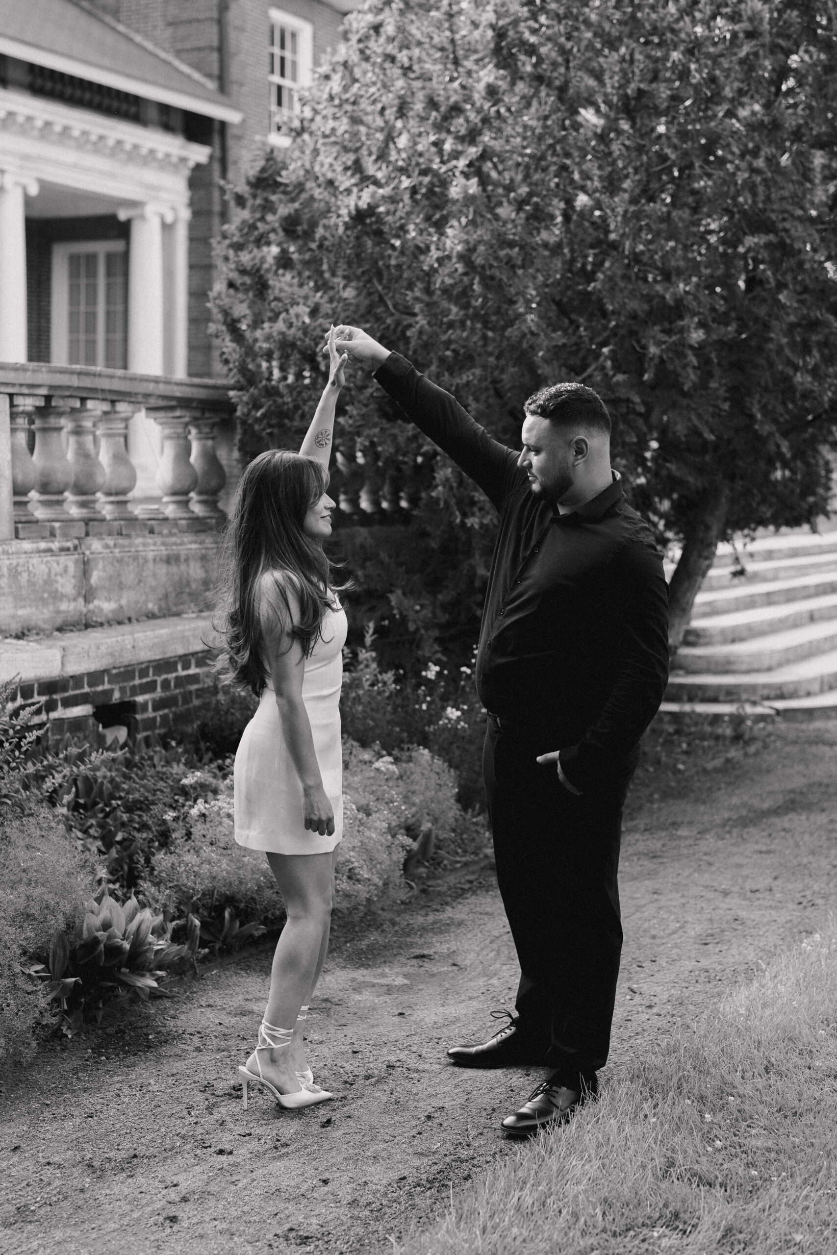 Newly engaged couple dancing for their Garden at Elm Bank Engagement Session