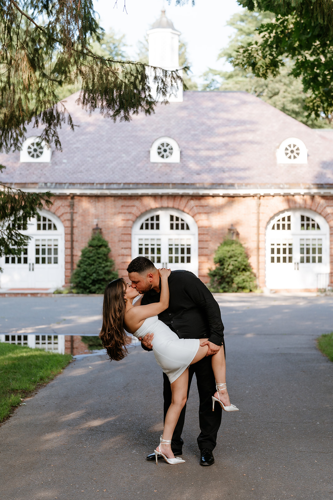 A man and woman at The Garden at Elm Bank during their engagement session