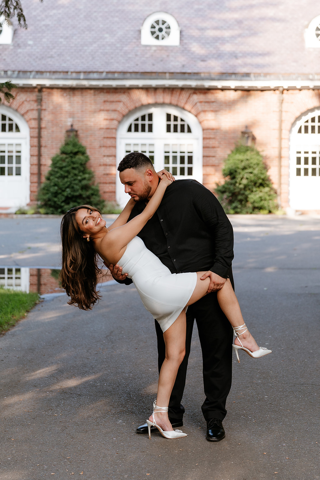 A man and woman at The Garden at Elm Bank during their engagement session