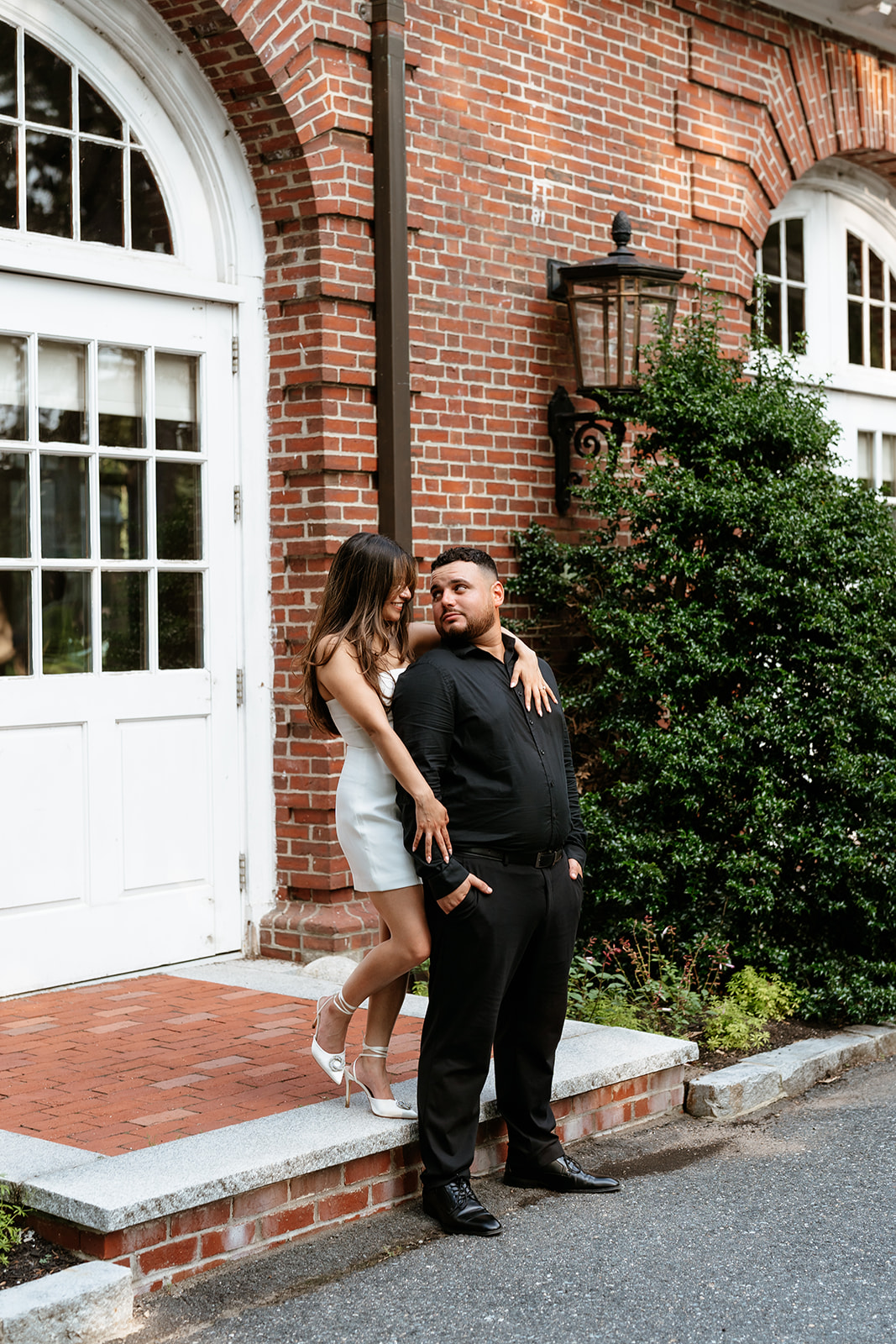 A man and woman at The Garden at Elm Bank during their engagement session