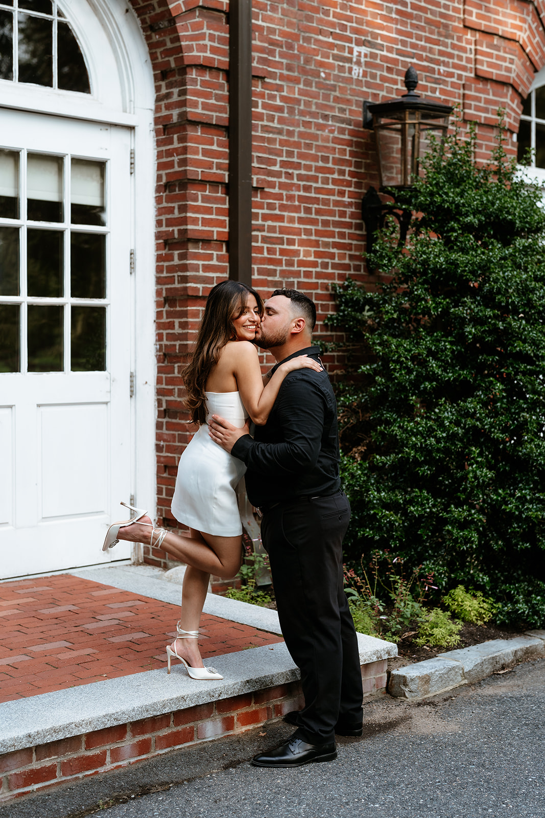 A man and woman at The Garden at Elm Bank during their engagement session