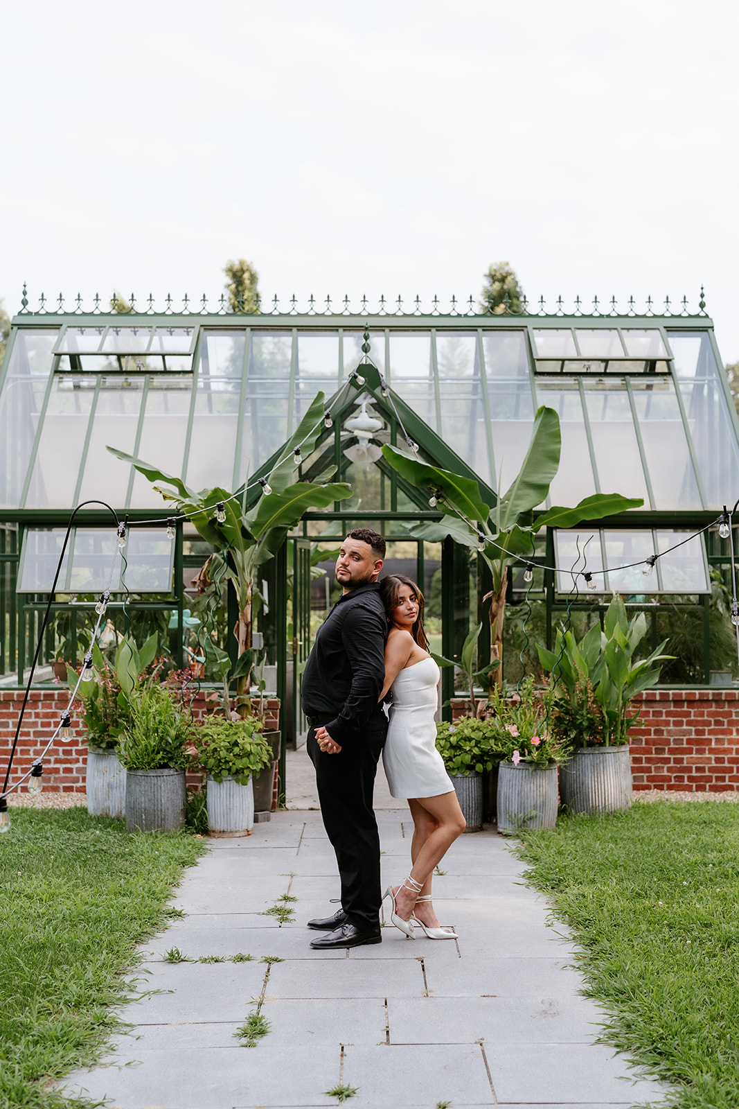 A man and woman at The Garden at Elm Bank during their engagement session