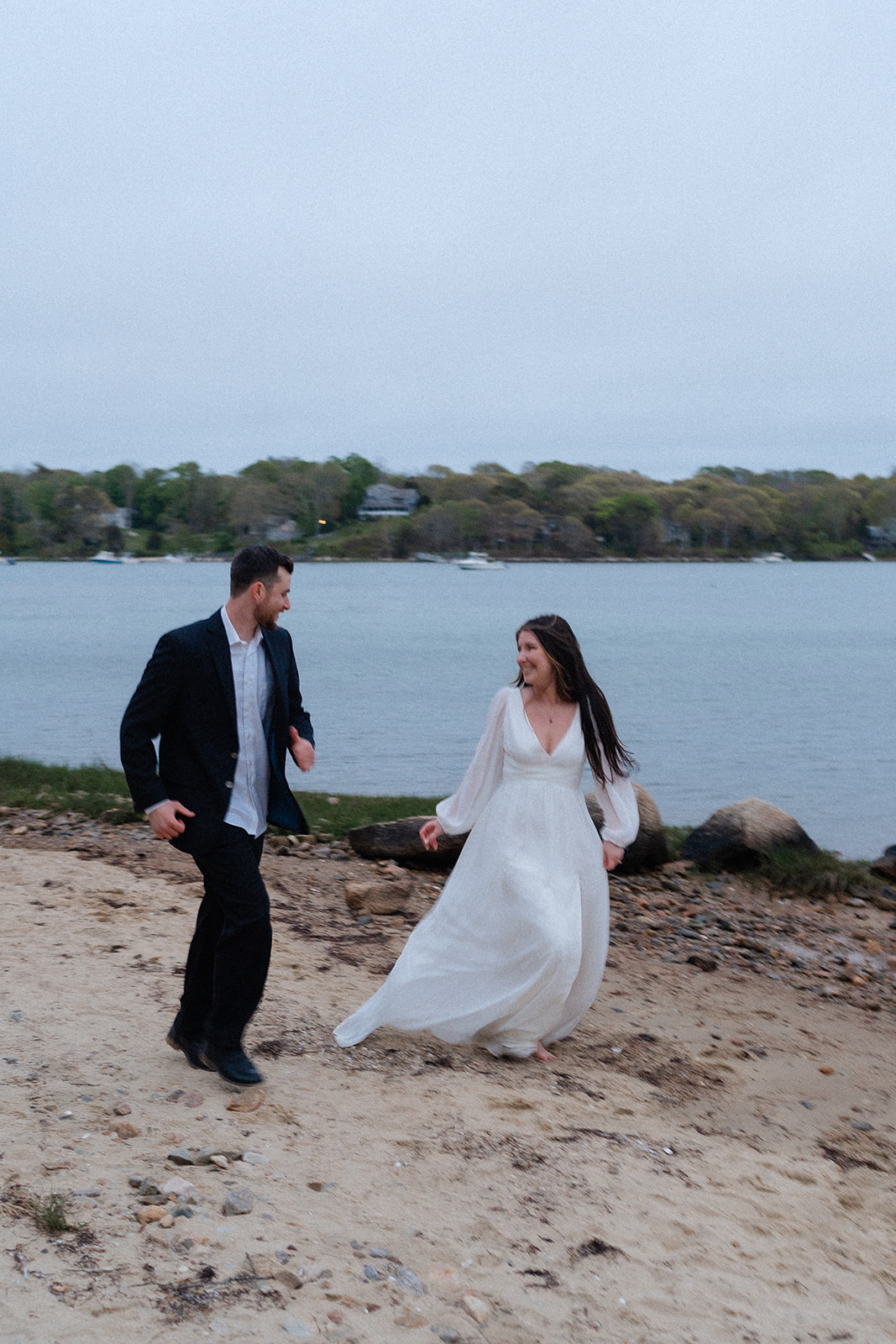 Engaged couple dancing on the beach for their Cape Cod engagement session