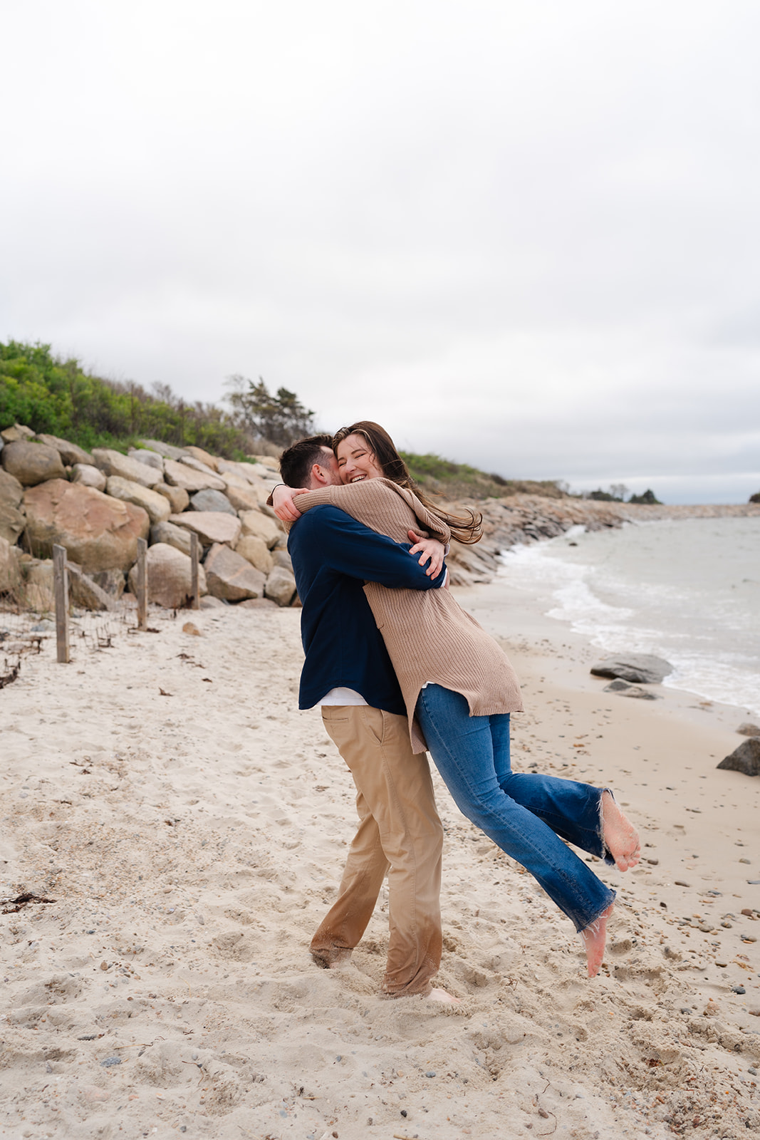 Engaged couple dancing on the beach for their Cape Cod engagement session