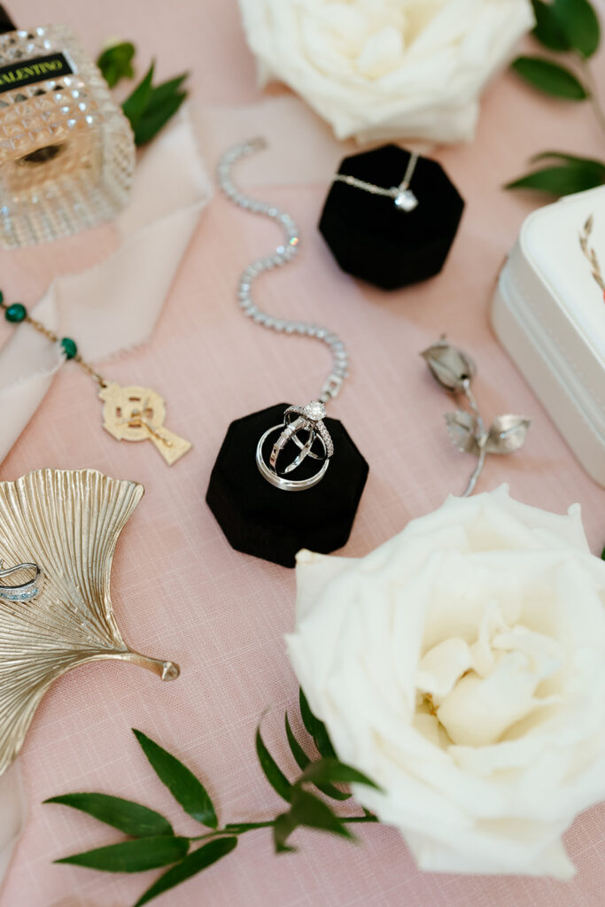 Close up photo of the bride's ring on a flat lay with all bride's items