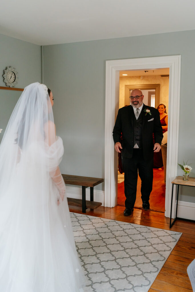 Bride and father first look at a Airbnb cozy house 