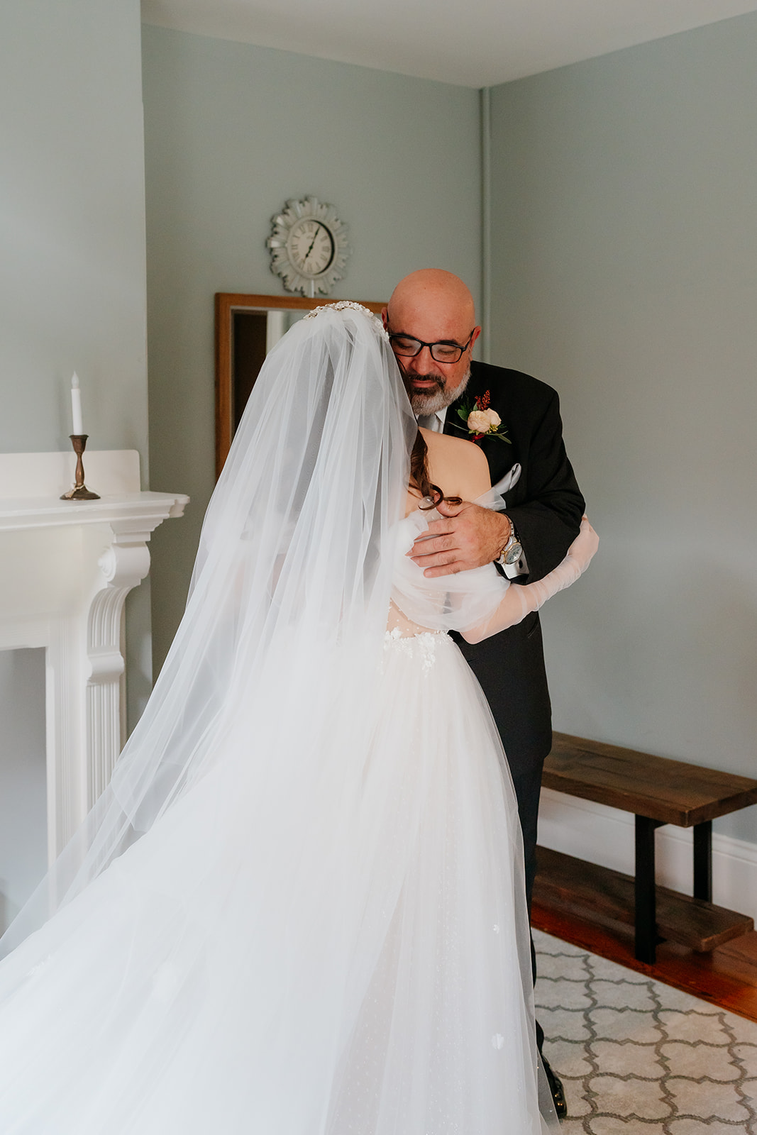 first look of the bride and bride's father and they are hugging