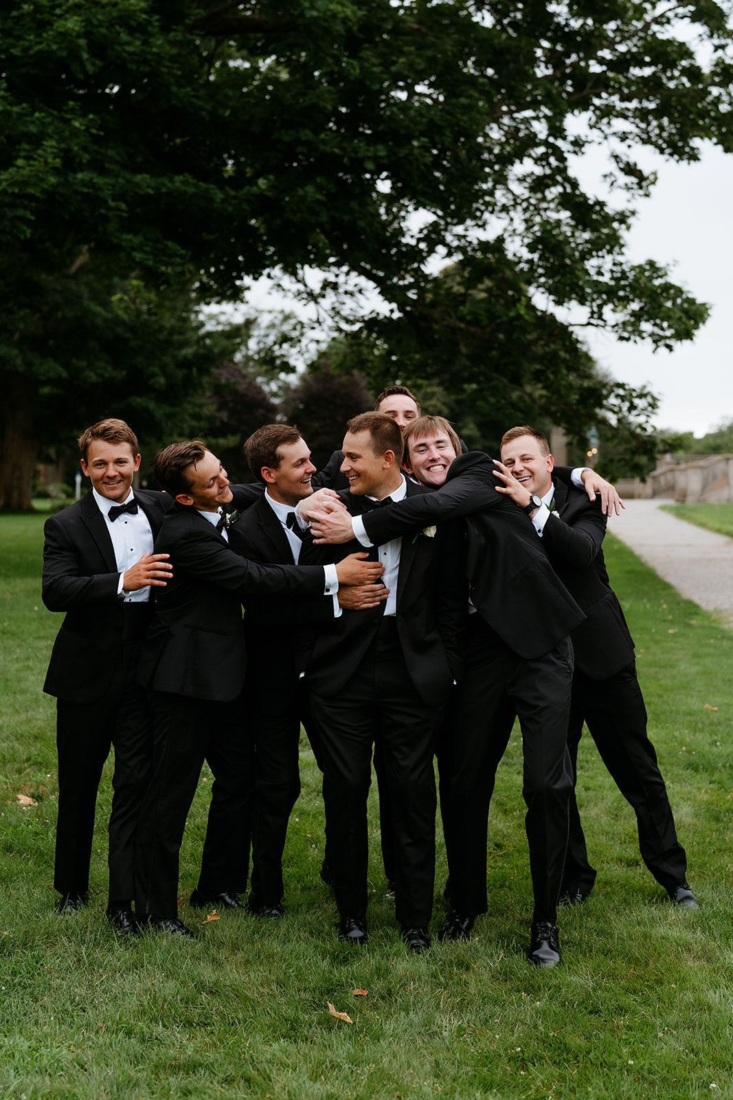 fun and carefree groom and groomsmen photo at Newport, Rhode Island