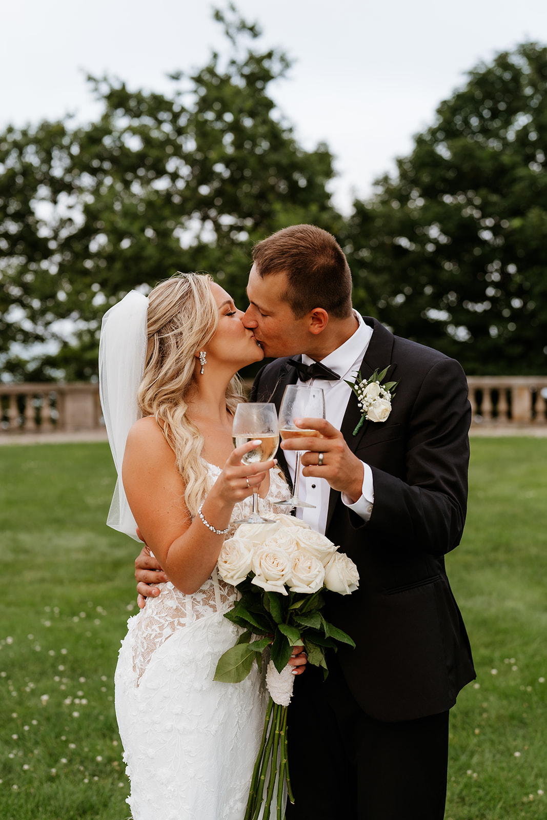 bride and groom kissing toasting at Ochre Court 