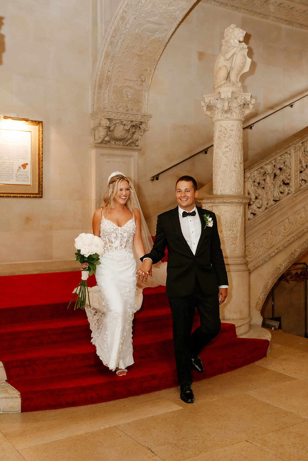 bride and groom walking down the stairs at Ochre Court