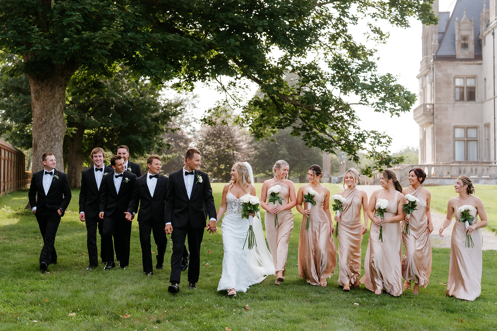 candid wedding photo of bride, groom, bridesmaids and groomsmen outdoor at Ochre Court 