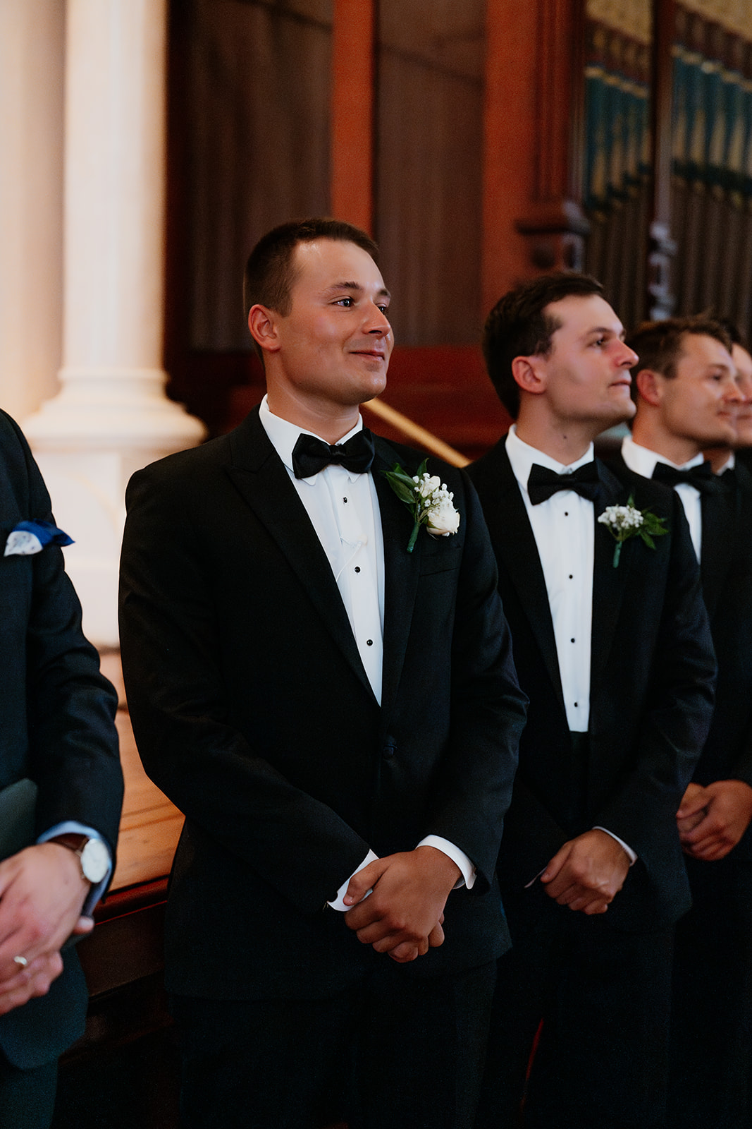 groom looking at his bride during a traditional wedding ceremony in a church