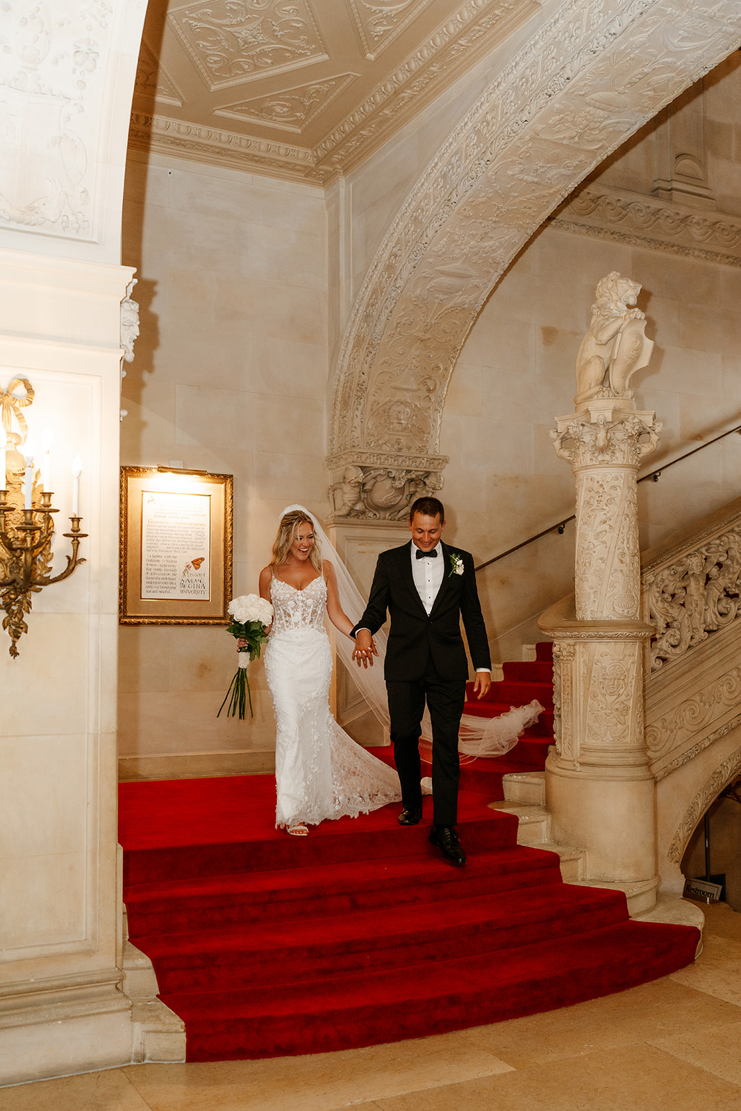 bride and groom walking down the stairs at Ochre Court Wedding