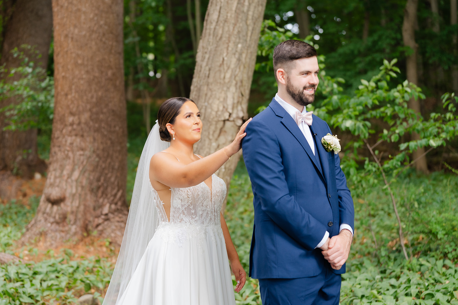 first look of bride and groom in the garden