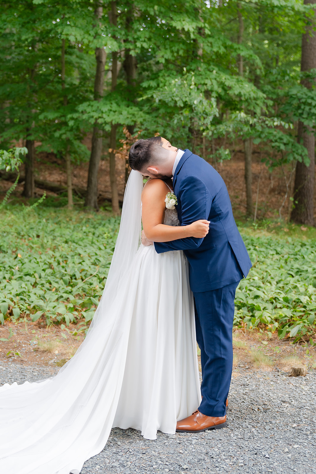 bride and groom hugging after first look reveal