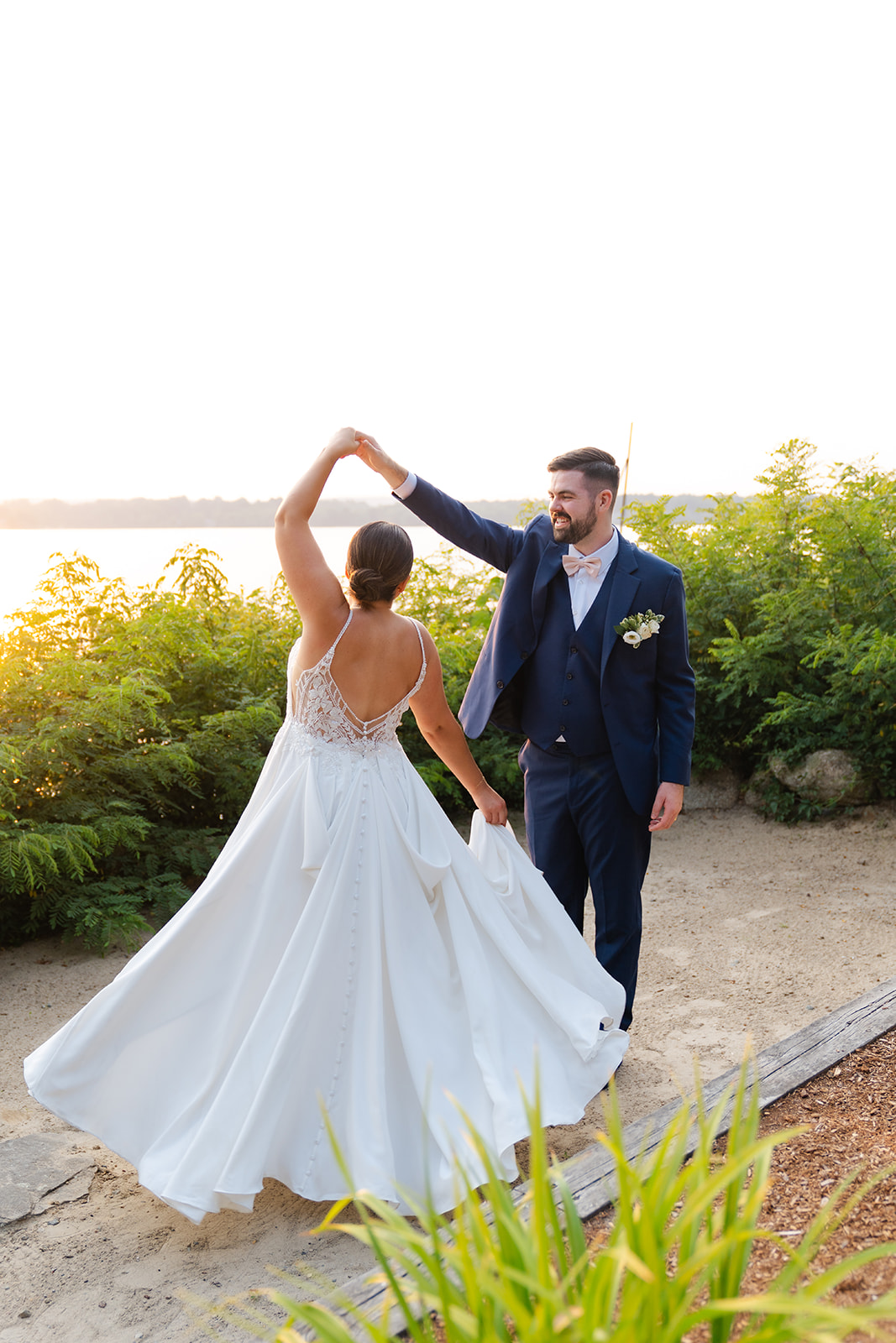 candid wedding photo of bride and groom dancing