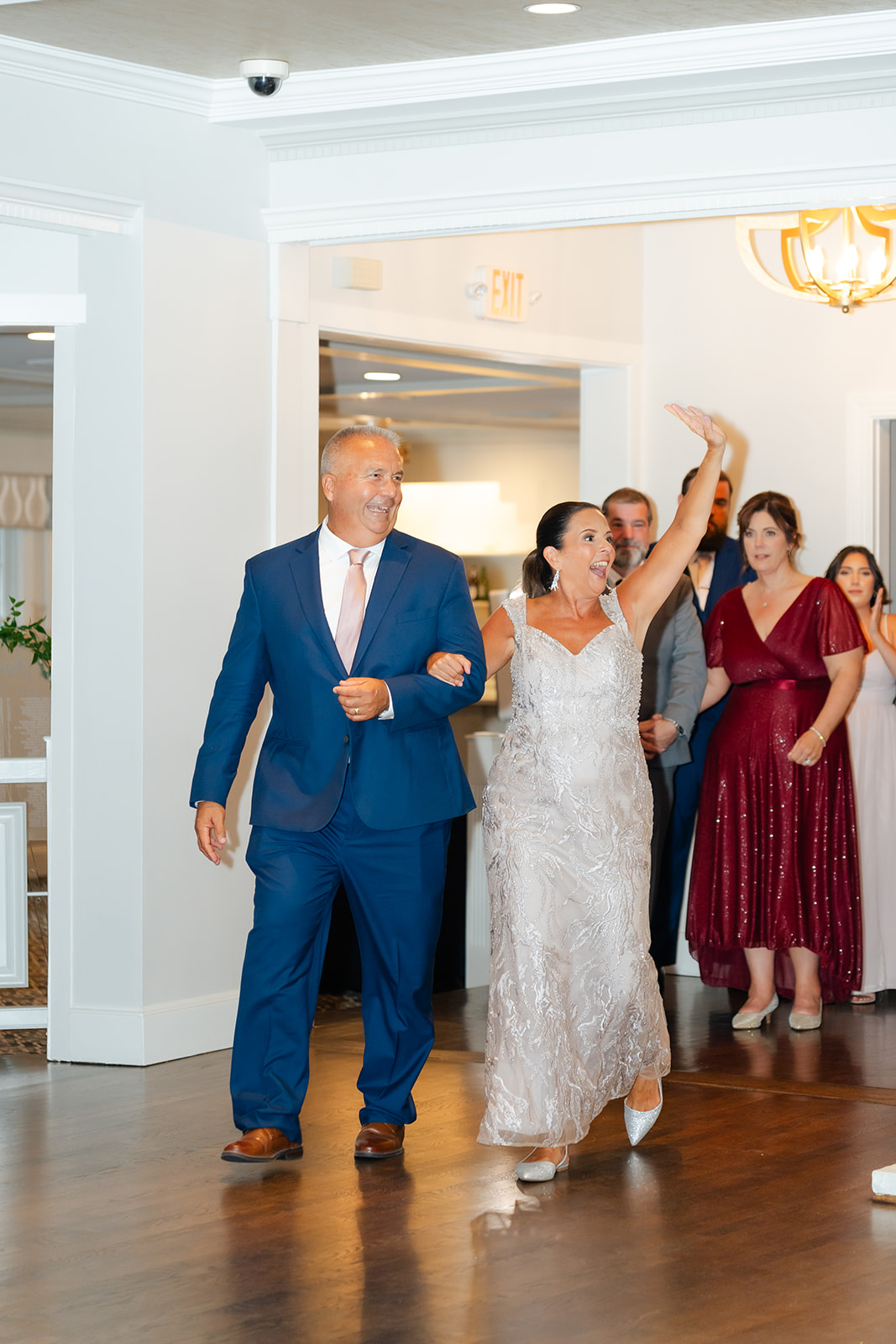 bride's parents entering the wedding reception