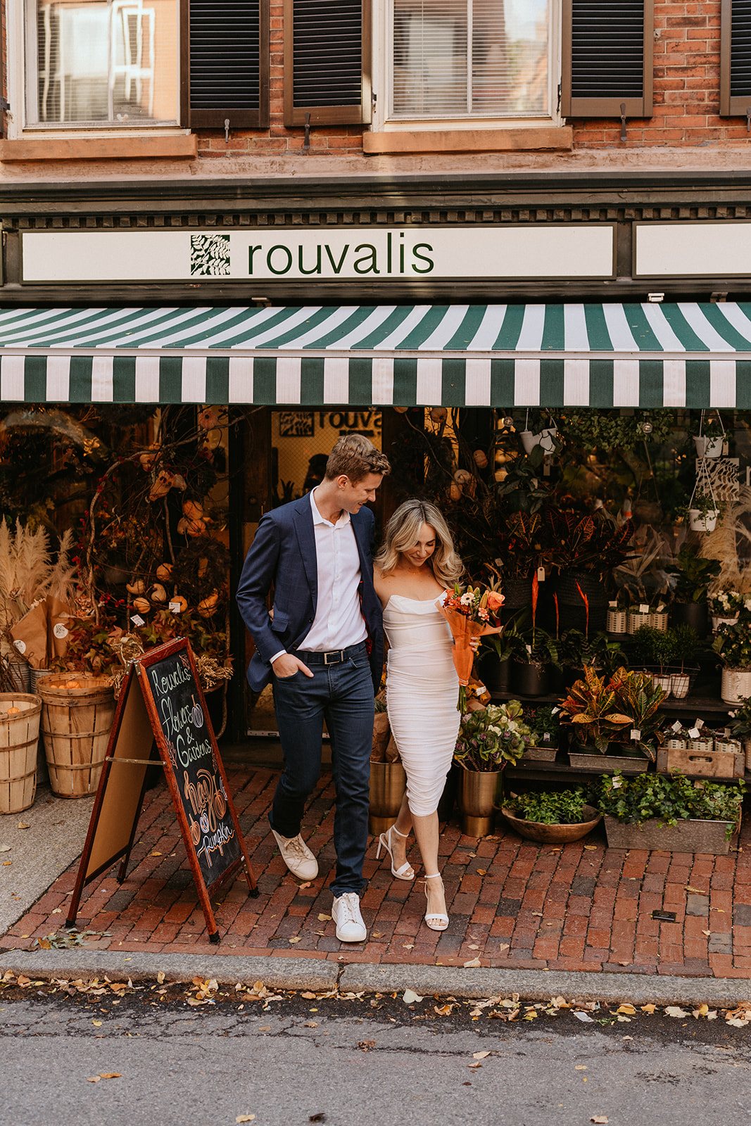 couple walking out of the fall florist shop