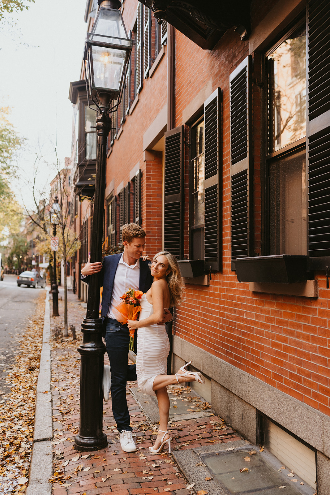 engaged photo of the couple at the streets of North End