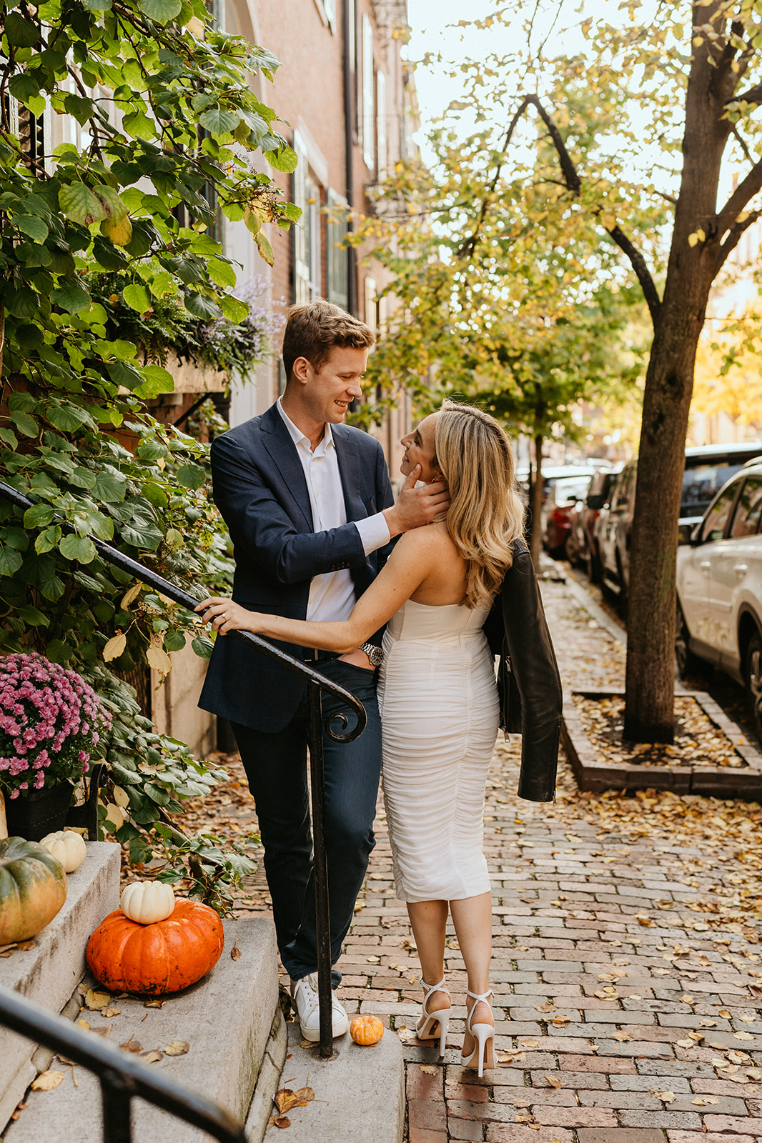 engaged couple talking at the stairs of downtown boston building