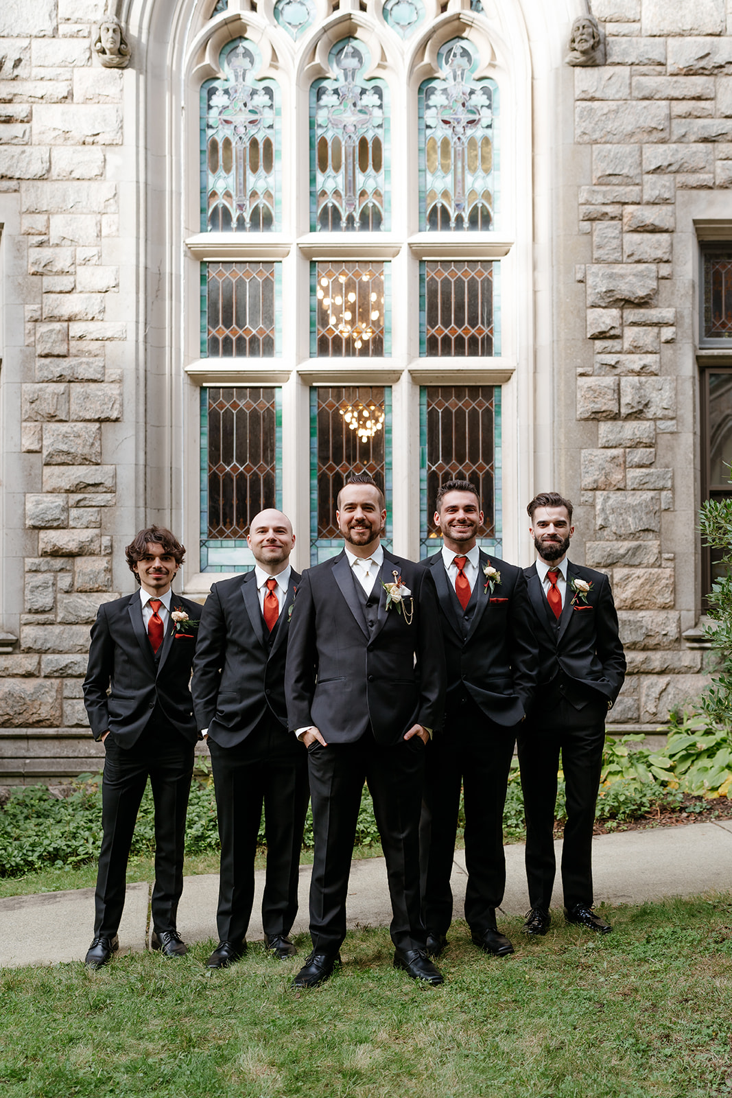 groom and his groomsmen smiling for the photo