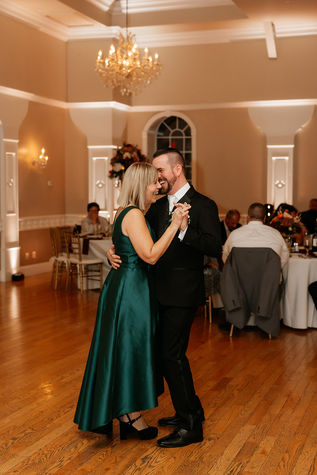 son and mother dance during wedding reception