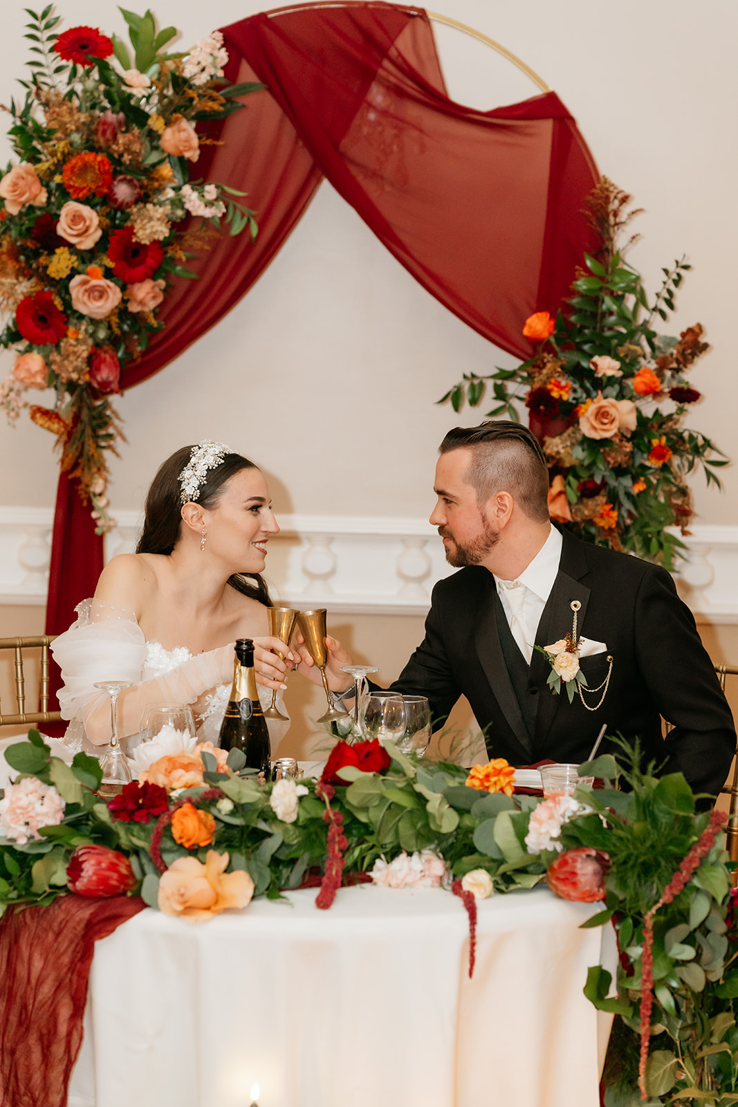 bride and groom toasting during wedding reception