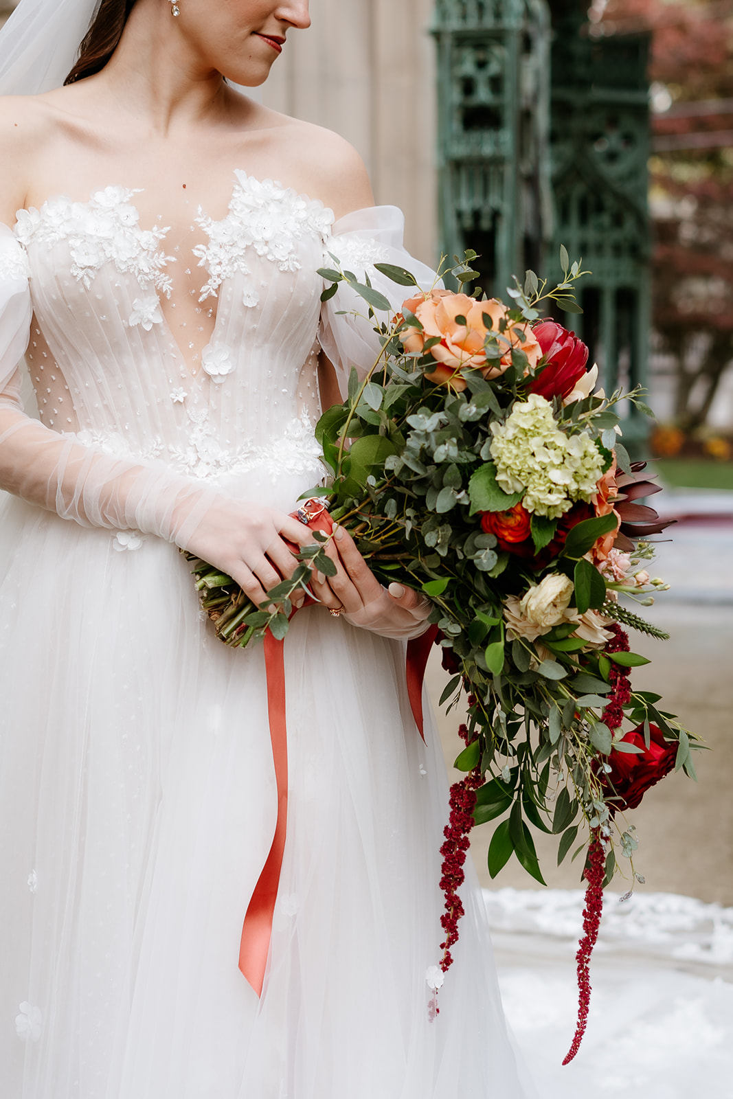 bride holding her colorful wedding bouquet