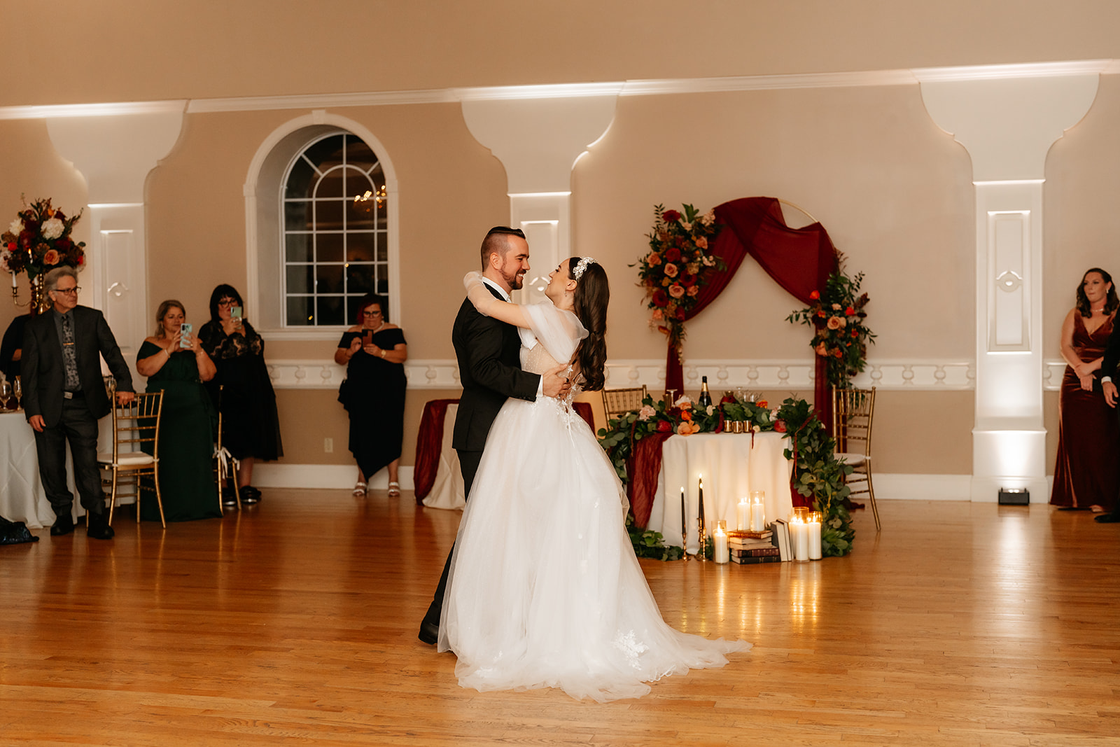 first dance of bride and groom in their ballroom wedding reception 