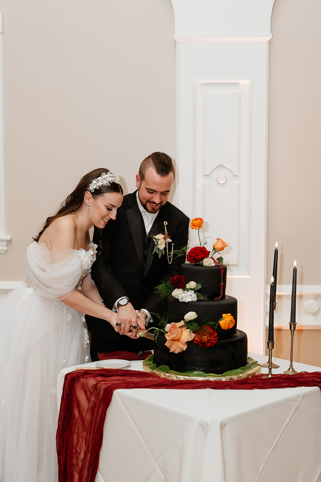 couple cutting a unique wedding cake for wedding ceremony