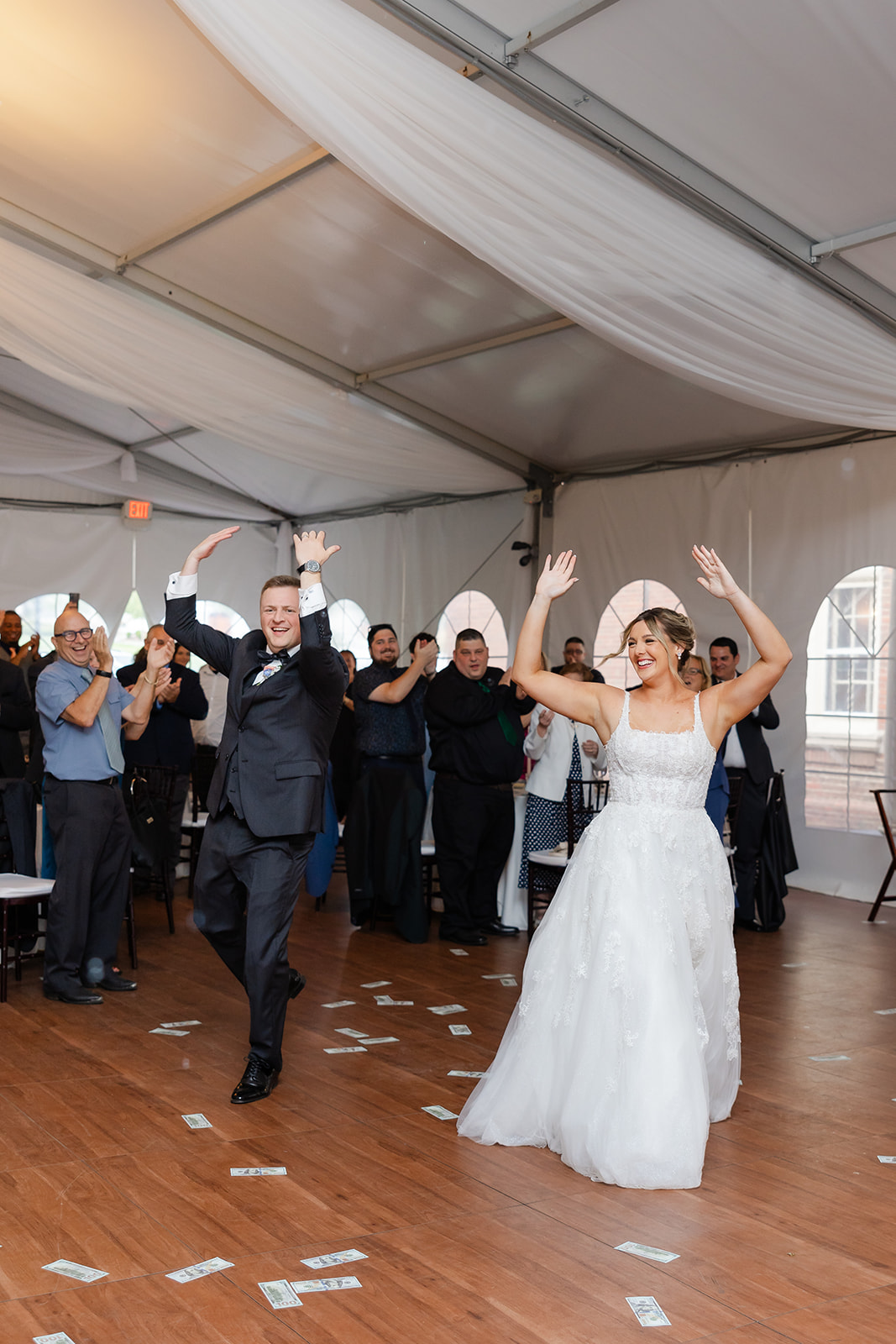 a fun entrance of the bride and groom during wedding reception 