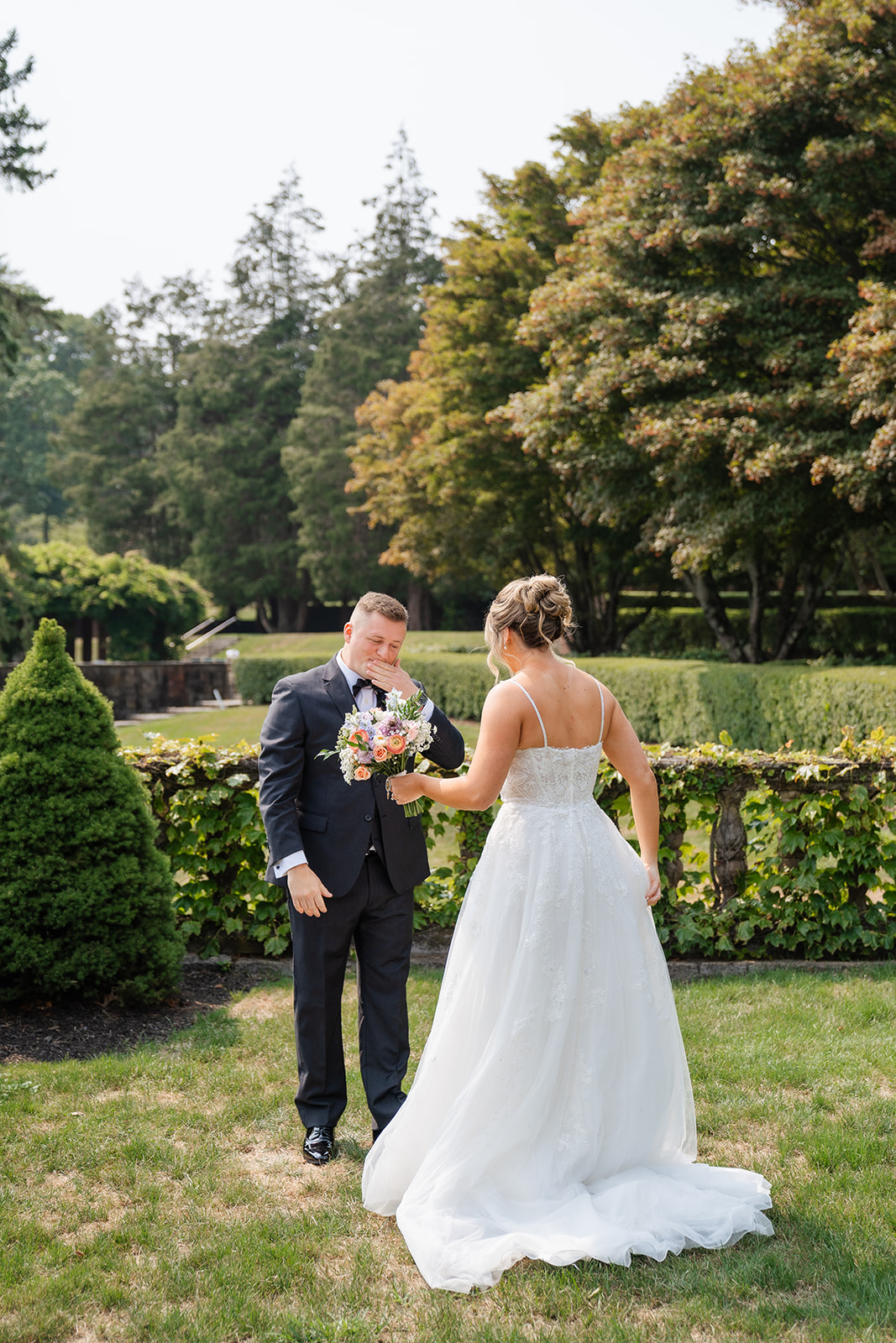 Groom looking amazed during first look of the bride