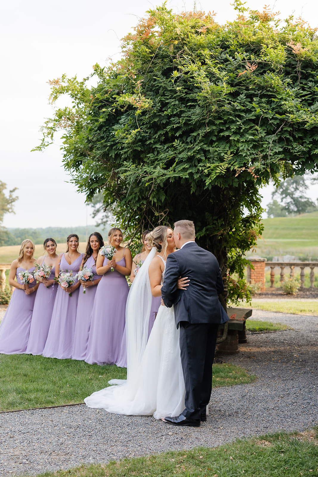 bride and groom kiss during wedding ceremony 