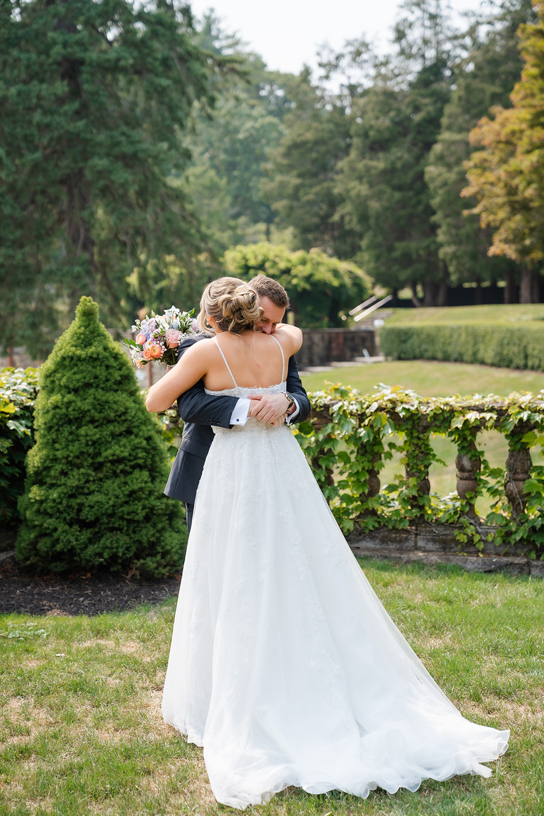 couple hugging during first look