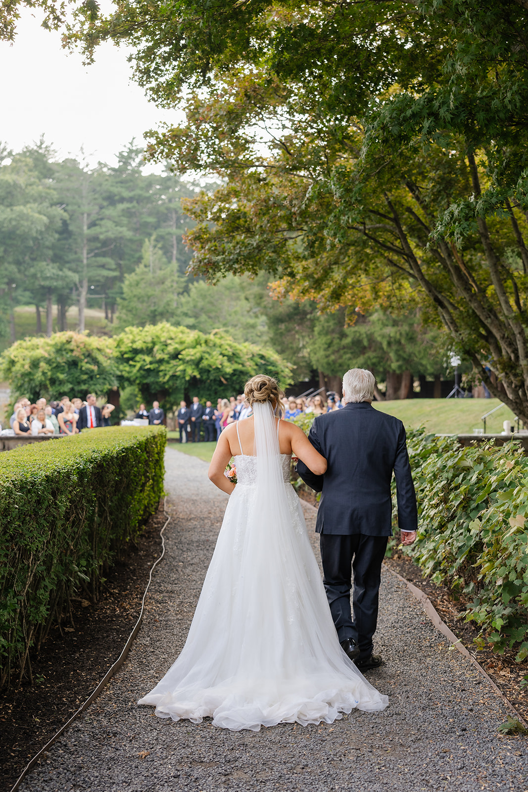 bride walking down the aisle with her father