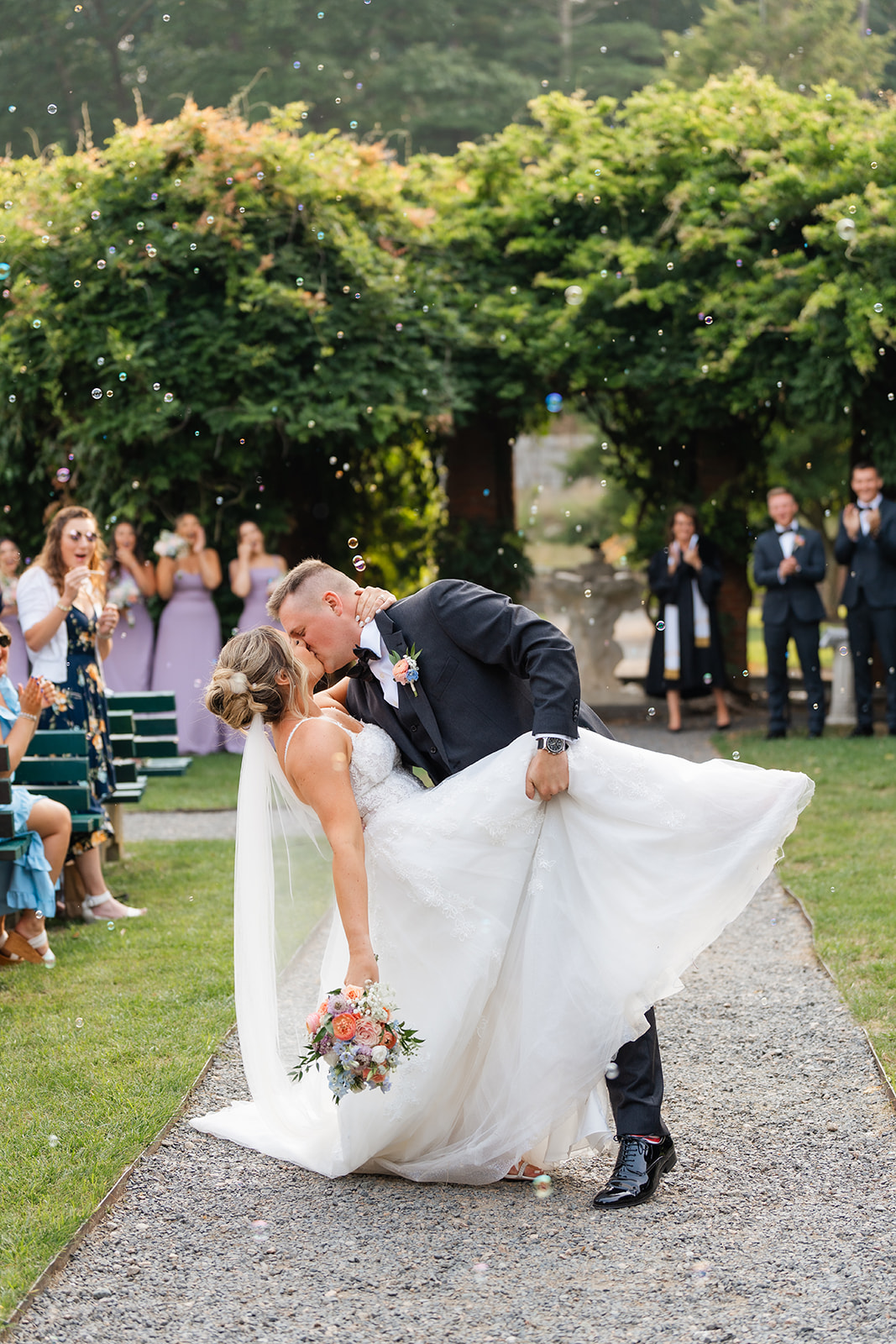 romantic wedding kiss of bride and groom during wedding ceremony