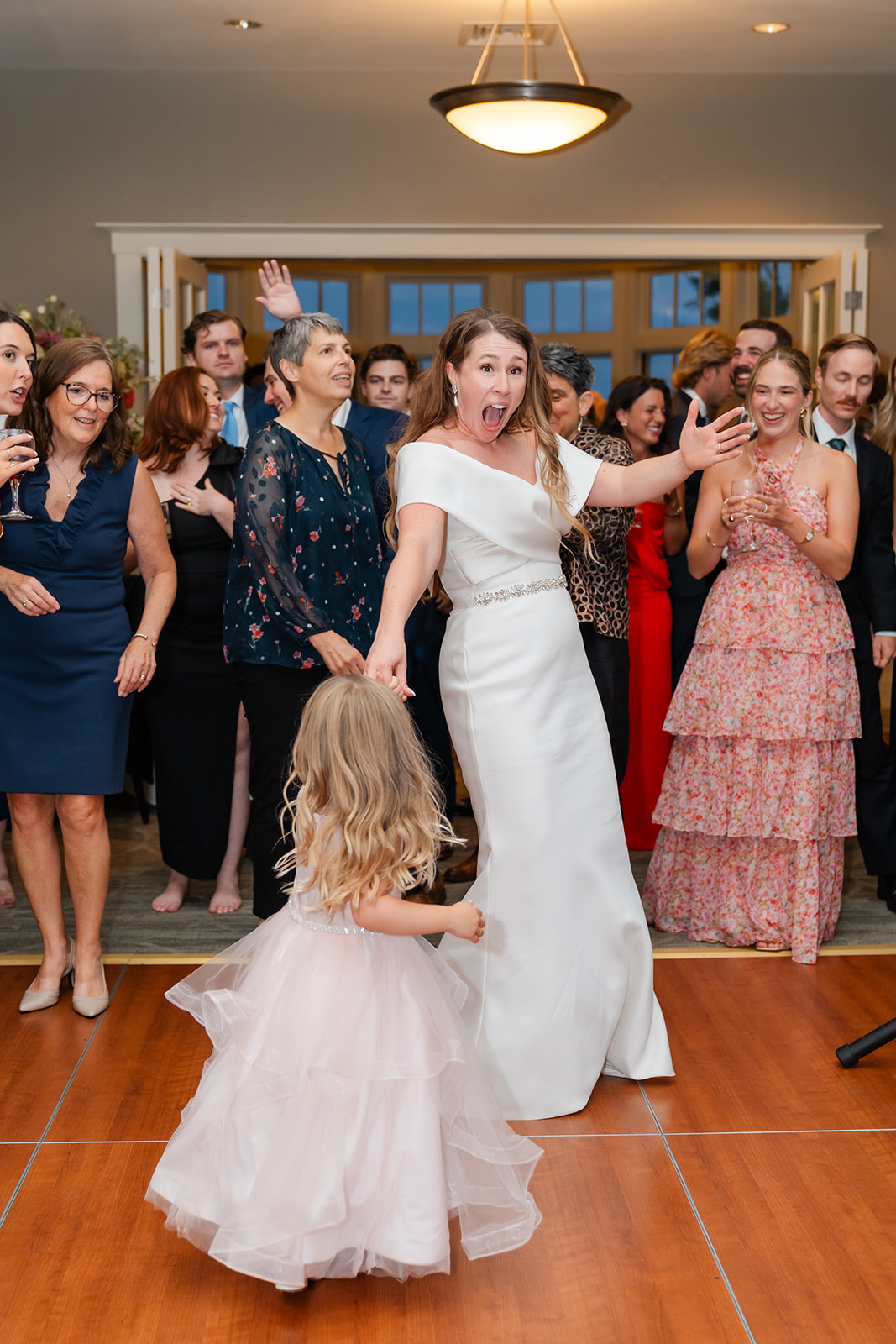 fun wedding part photo of the bride and a girl