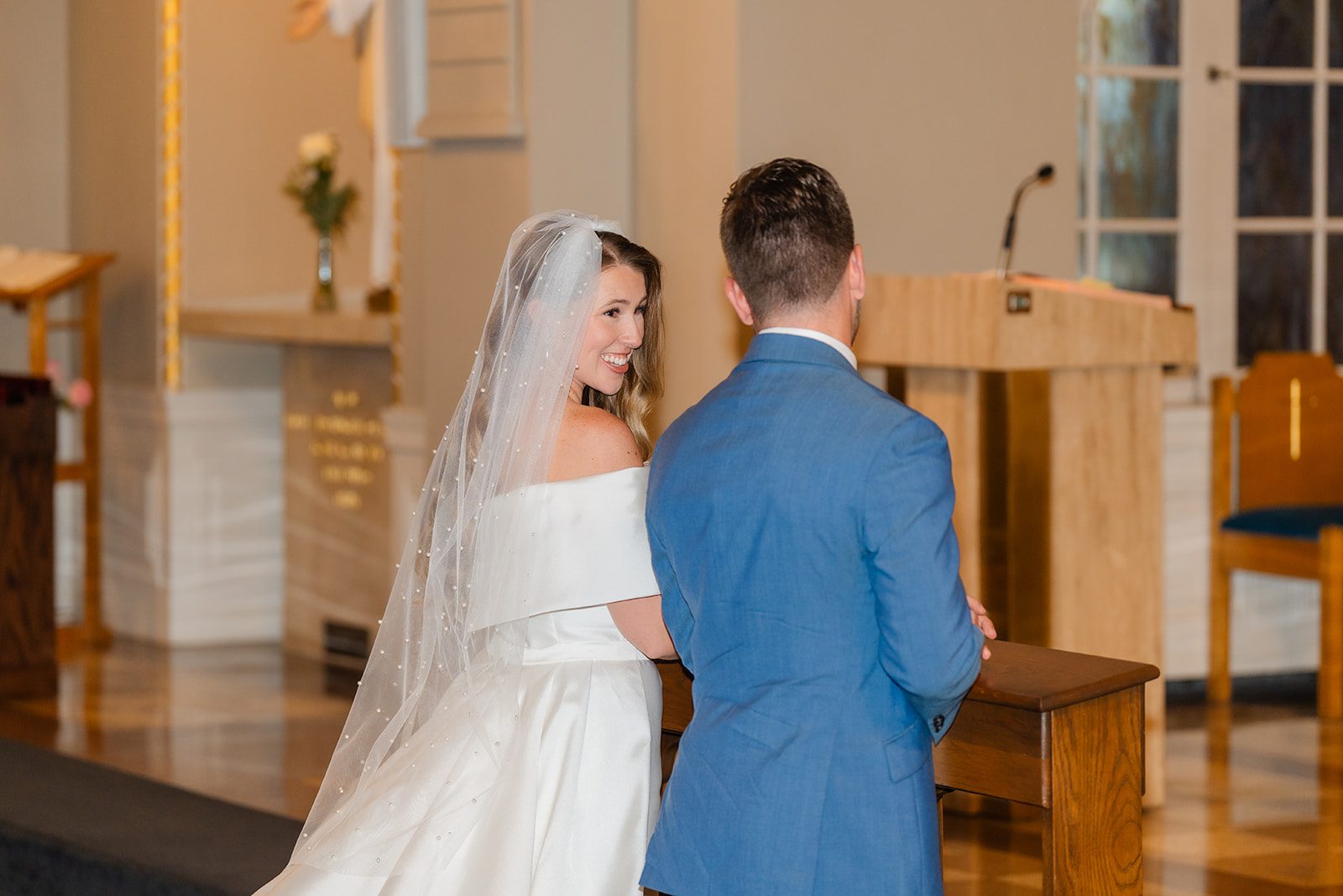 wedding ceremony photo of bride and groom in church