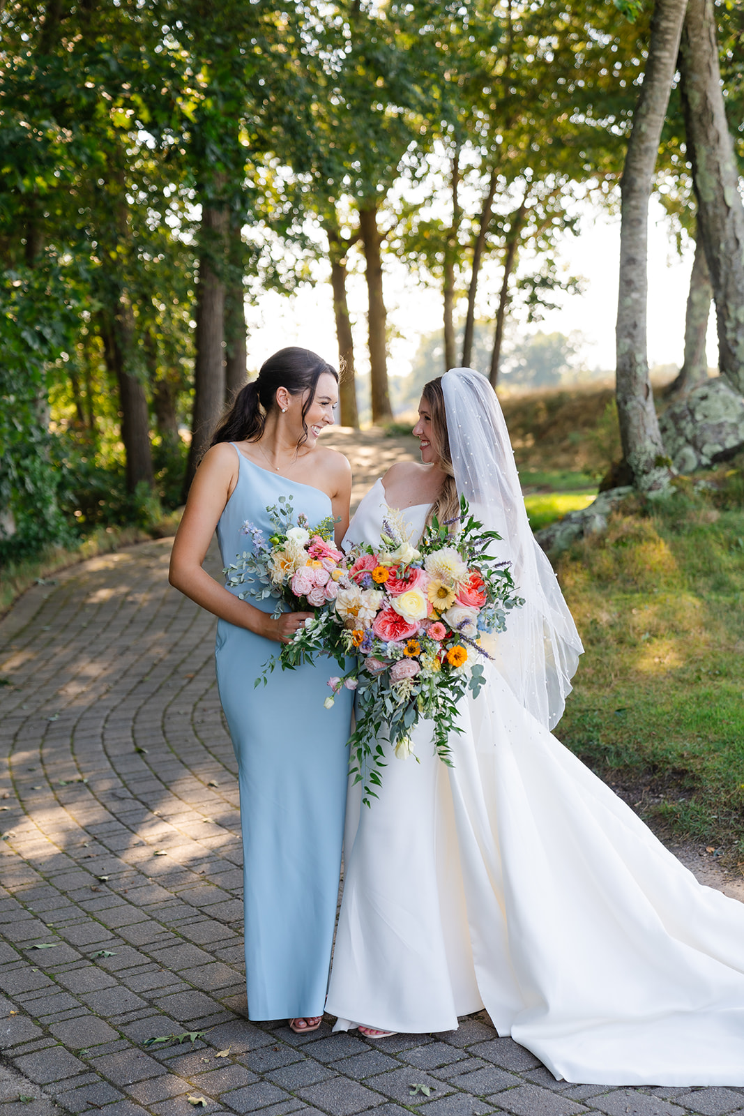 bride and bridesmaid portrait out at the garden