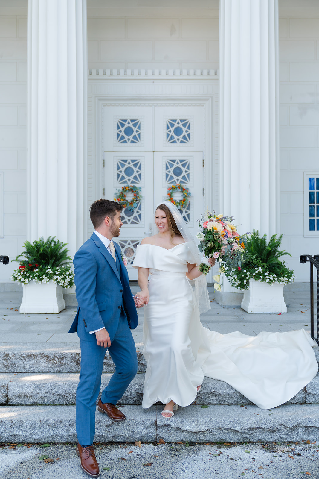 groom holding hands with the bride