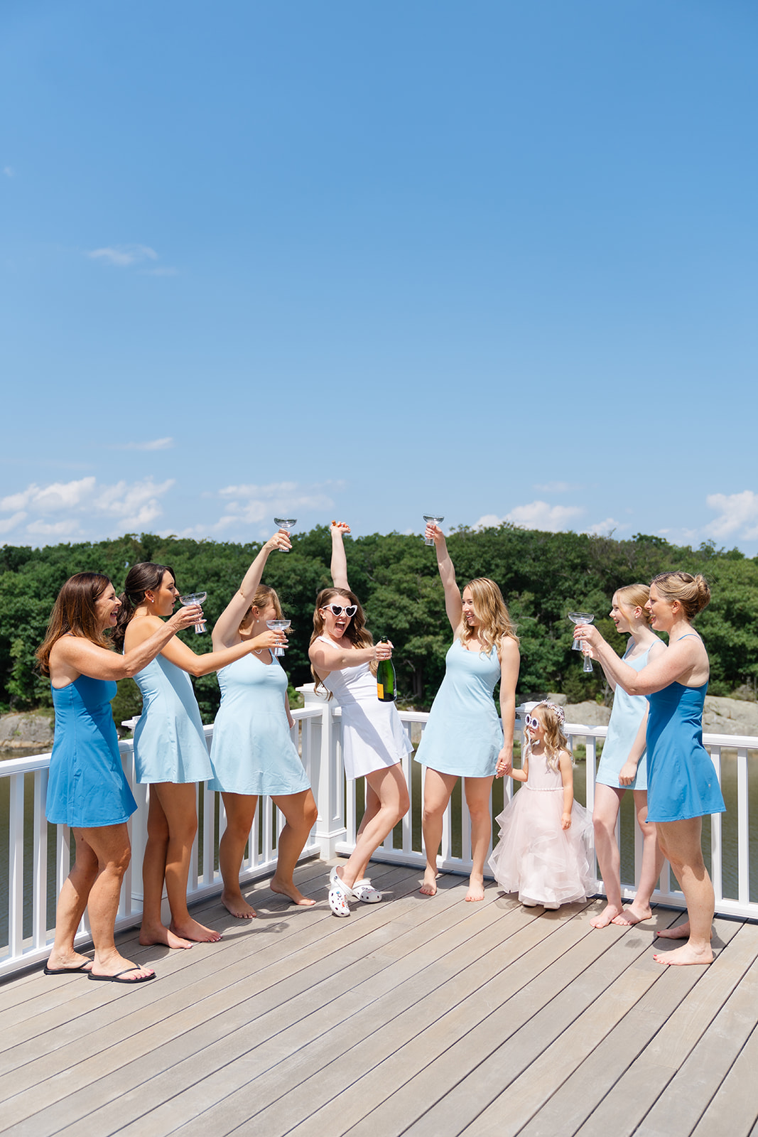 bride and bridesmaids getting ready raising a toast