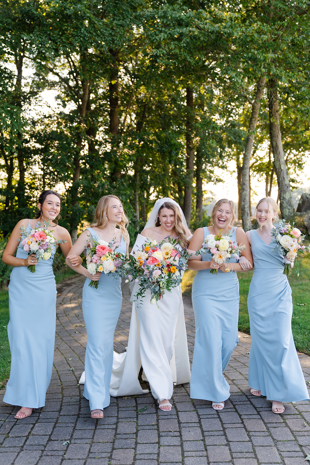 candid bride and bridesmaids picture outdoor 