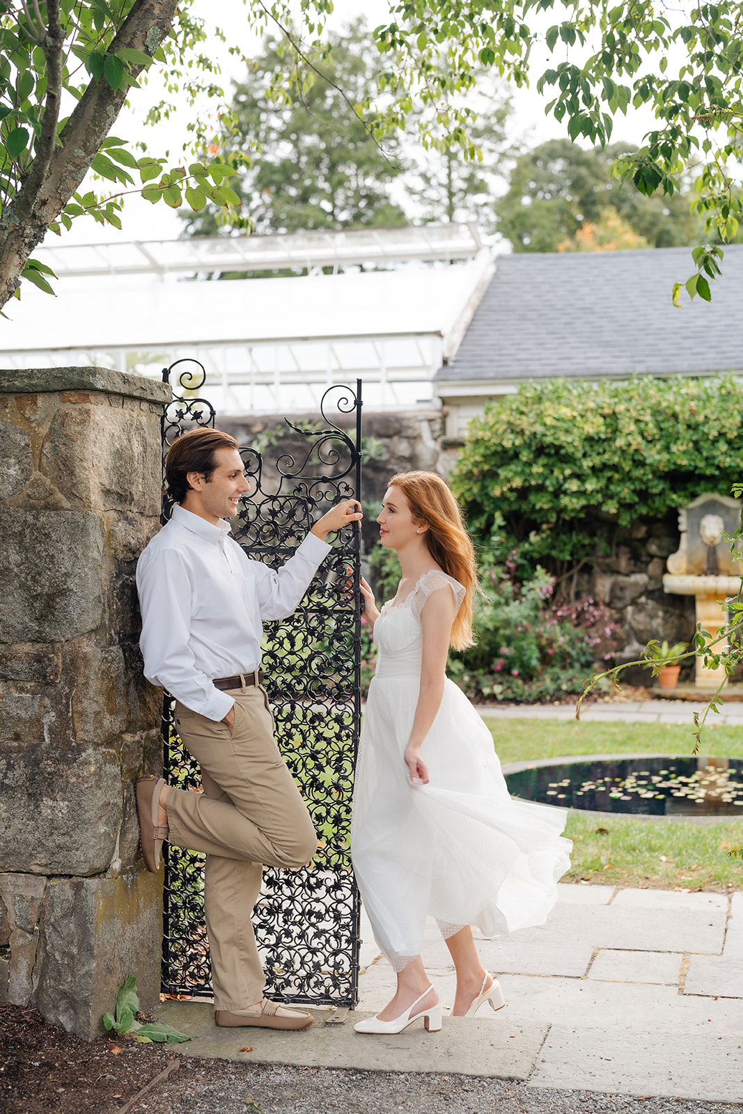 A couple walking together through the gardens, their love and connection captured in a relaxed yet stunning shot—unique engagement shoot ideas brought to life.